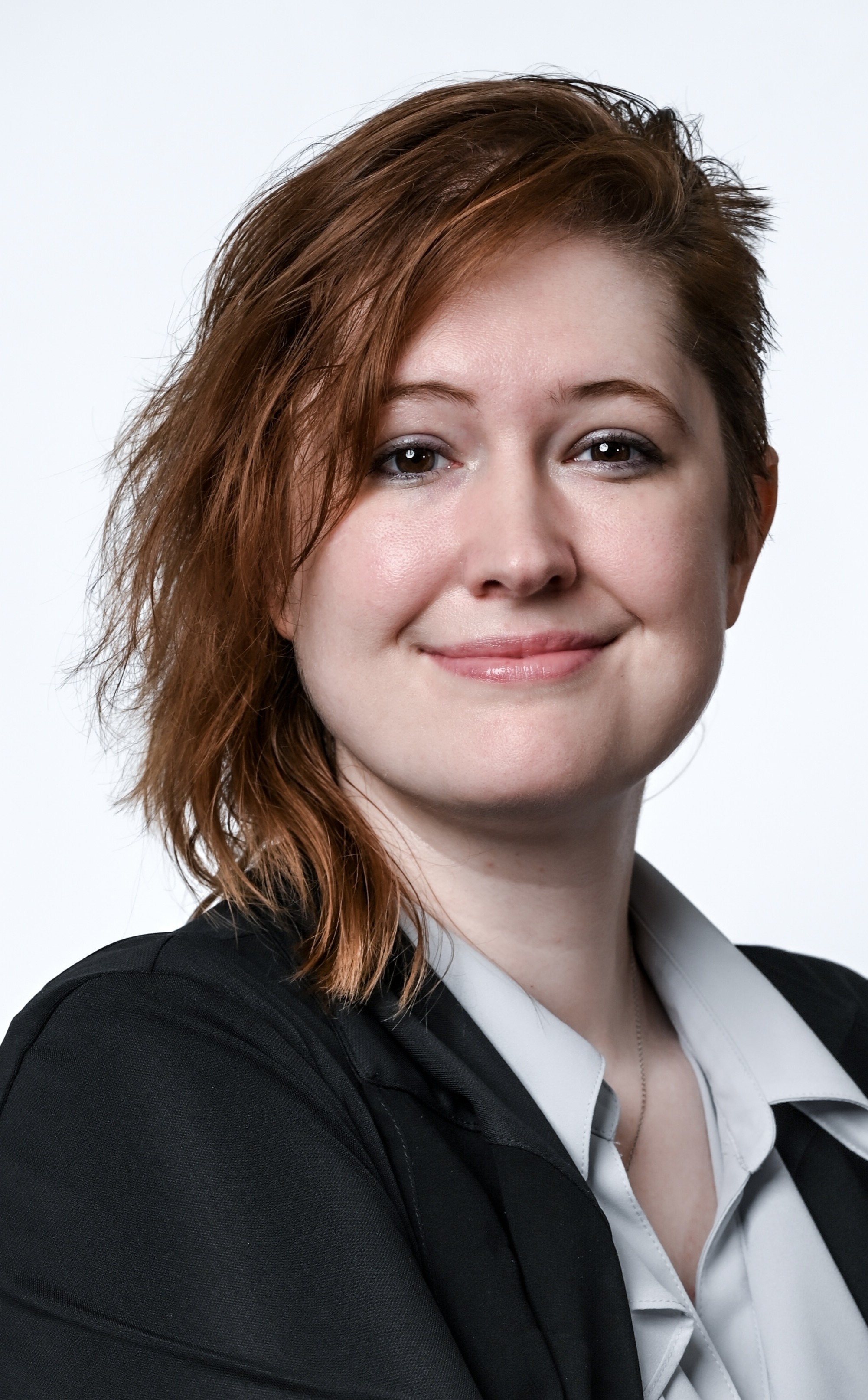 A photograph of a person with red-hair.